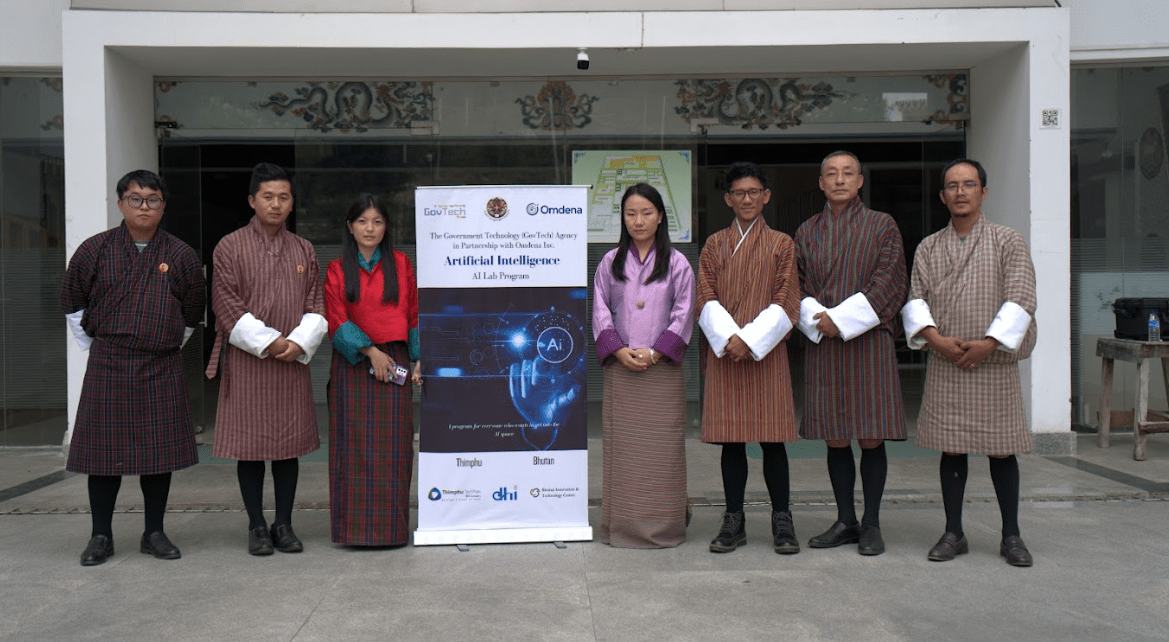 Bhutanese AI program launch event featuring local experts in traditional attire, highlighting community-driven innovation with GovTech and Omdena partners.